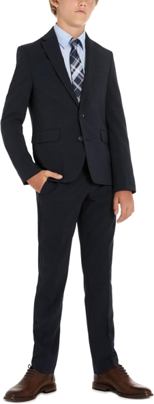 Kenneth Cole slim fit navy boys suit with dress shirt, plaid tie, and brown dress shoes